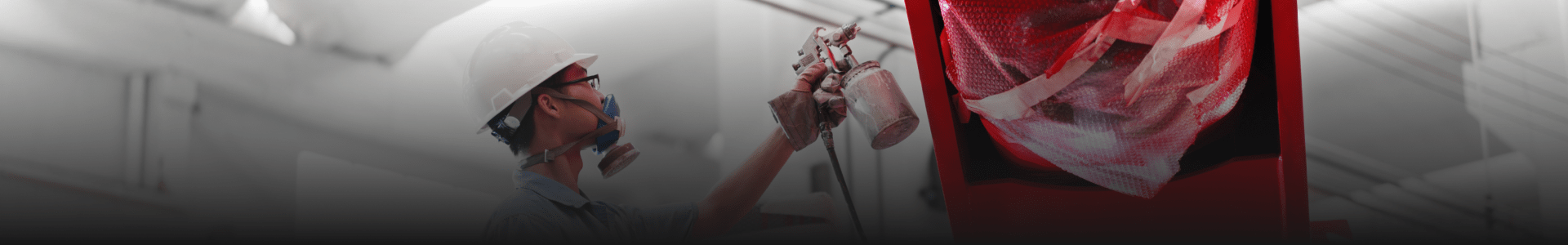 Paint spray gun worker painting a car Paint spray gun worker painting a car